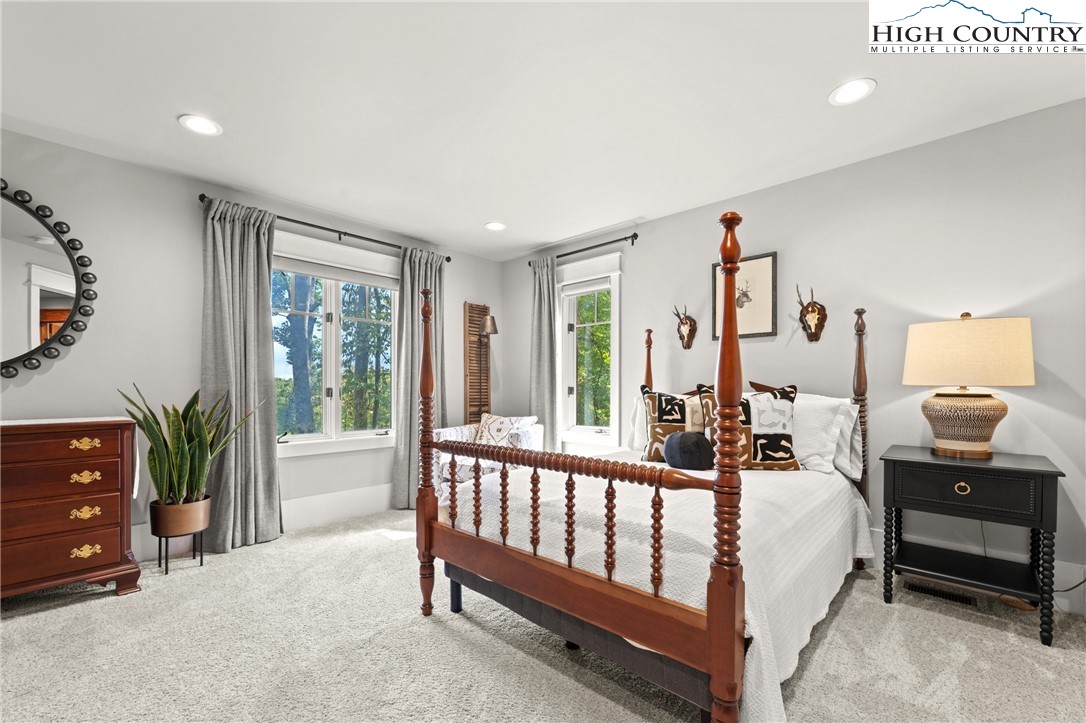 299 Edgewood Path Blowing Rock, NC 28605 - Photo 17 of 39 a bed room with a bed and a tv