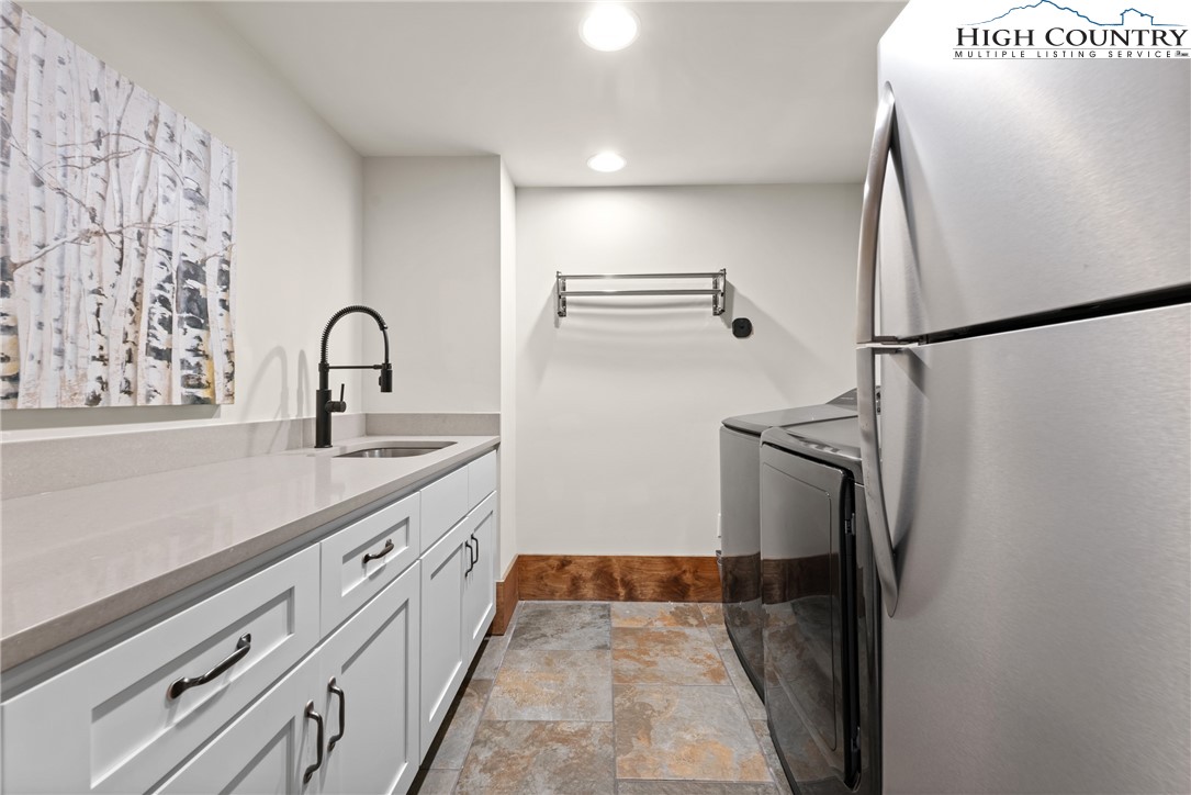 299 Edgewood Path Blowing Rock, NC 28605 - Photo 24 of 39 a kitchen with stainless steel appliances a refrigerator and cabinets