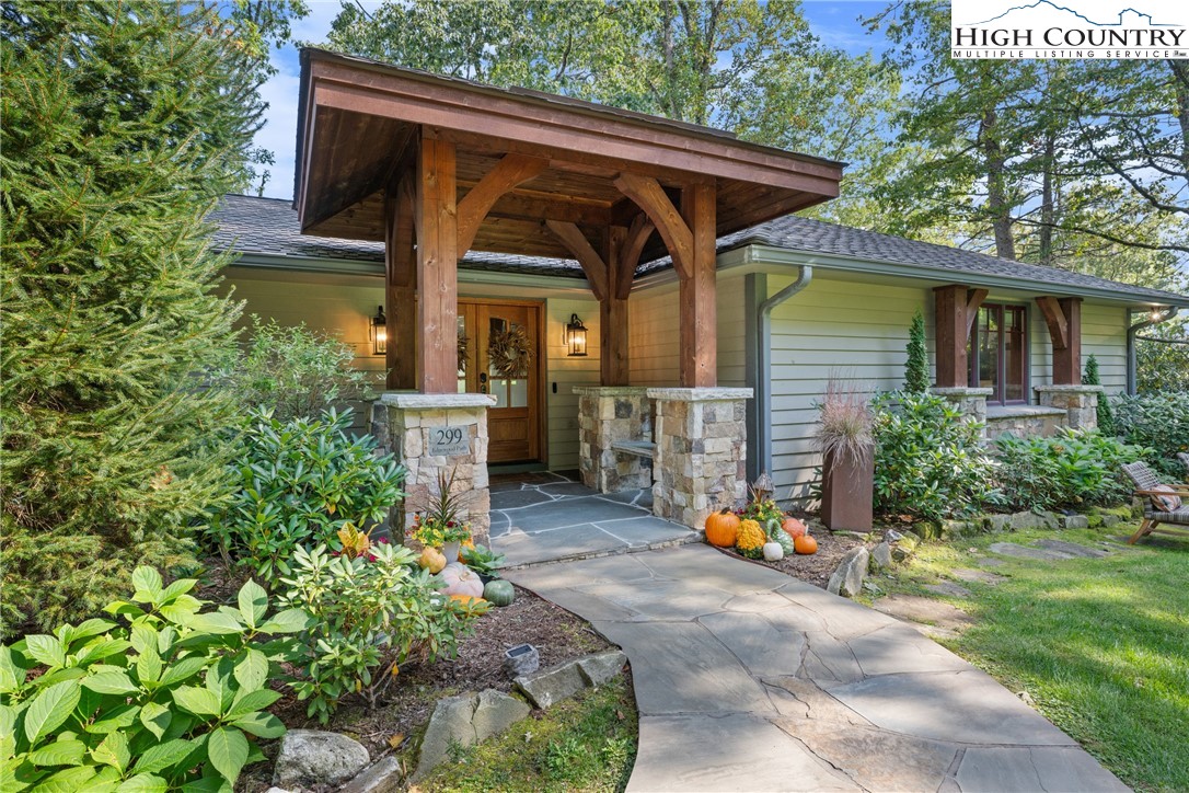 299 Edgewood Path Blowing Rock, NC 28605 - Photo 29 of 39 a front view of a house with garden