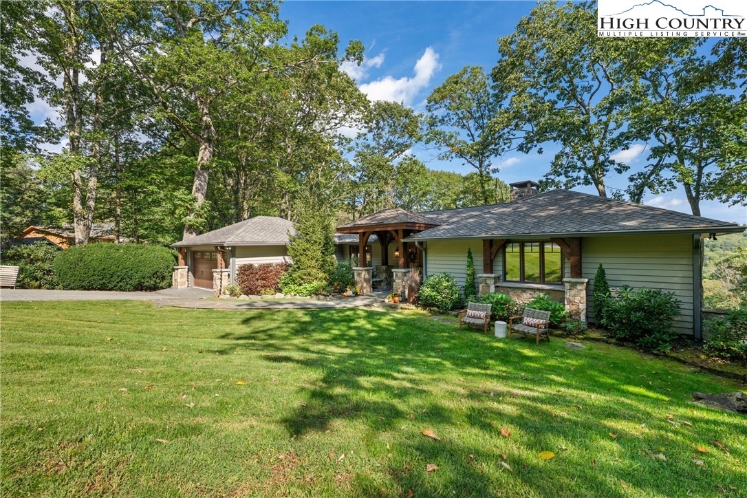 299 Edgewood Path Blowing Rock, NC 28605 - Photo 31 of 39 a front view of a house with garden