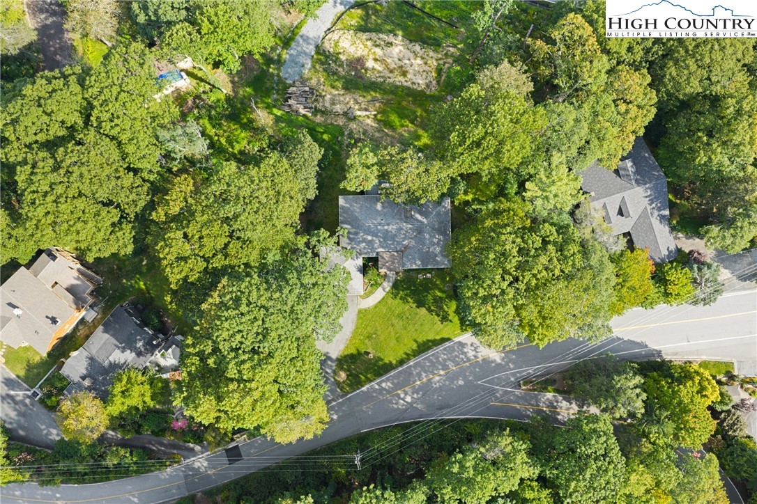299 Edgewood Path Blowing Rock, NC 28605 - Photo 34 of 39 an aerial view of a house with a yard basket ball court and outdoor seating