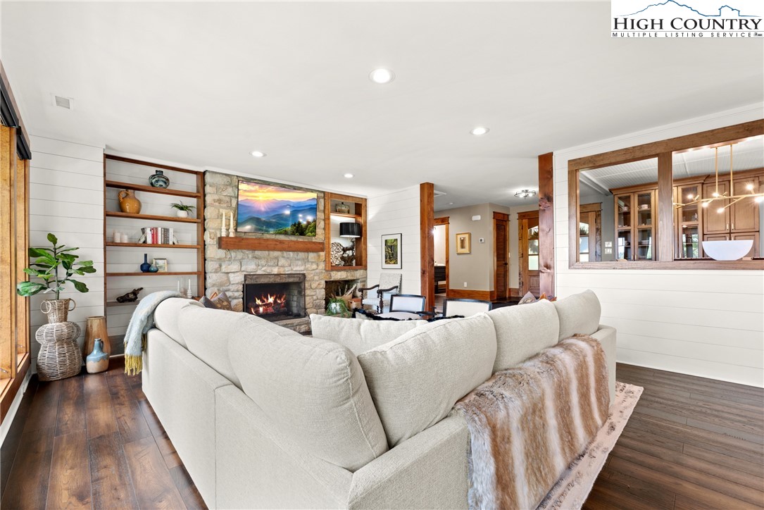 299 Edgewood Path Blowing Rock, NC 28605 - Photo 7 of 39 a living room with fireplace furniture and a large window