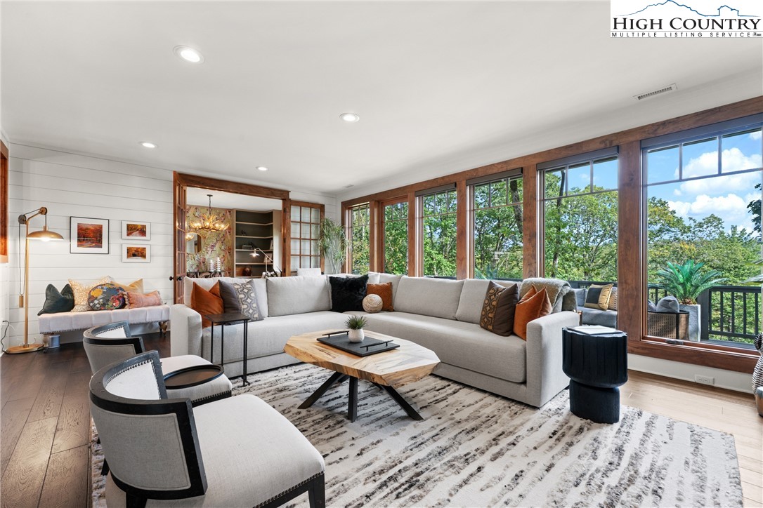 299 Edgewood Path Blowing Rock, NC 28605 - Photo 9 of 39 a living room with furniture and a large window