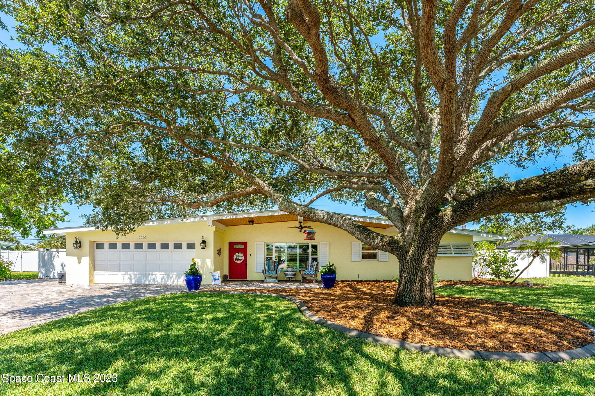2230 Reef Avenue Indialantic, FL 32903 - Photo 1 of 31 a view of a house with a yard