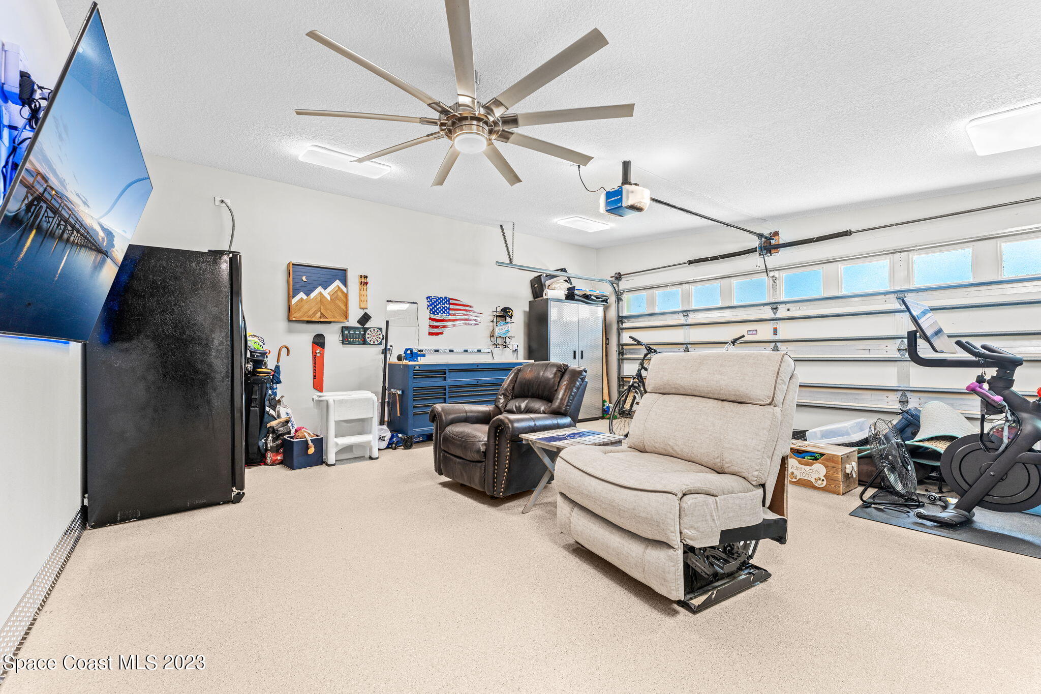 2230 Reef Avenue Indialantic, FL 32903 - Photo 17 of 31 a living room with furniture and a flat screen tv