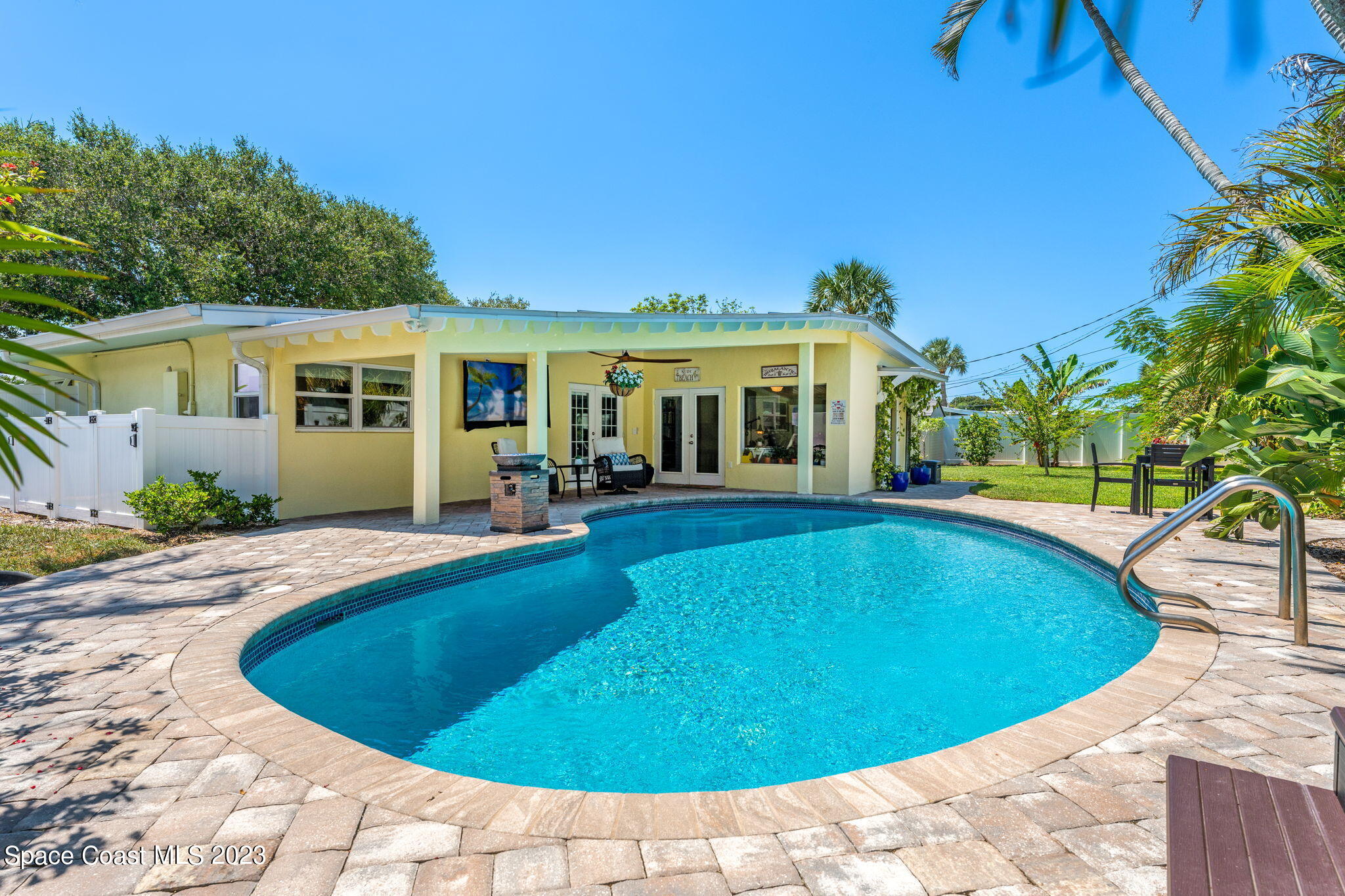 2230 Reef Avenue Indialantic, FL 32903 - Photo 20 of 31 a view of a house with swimming pool and porch