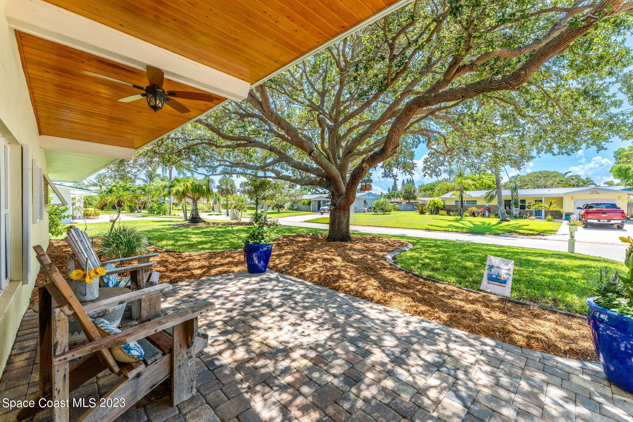 2230 Reef Avenue Indialantic, FL 32903 - Photo 2 of 31 a view of a table and chairs in the garden