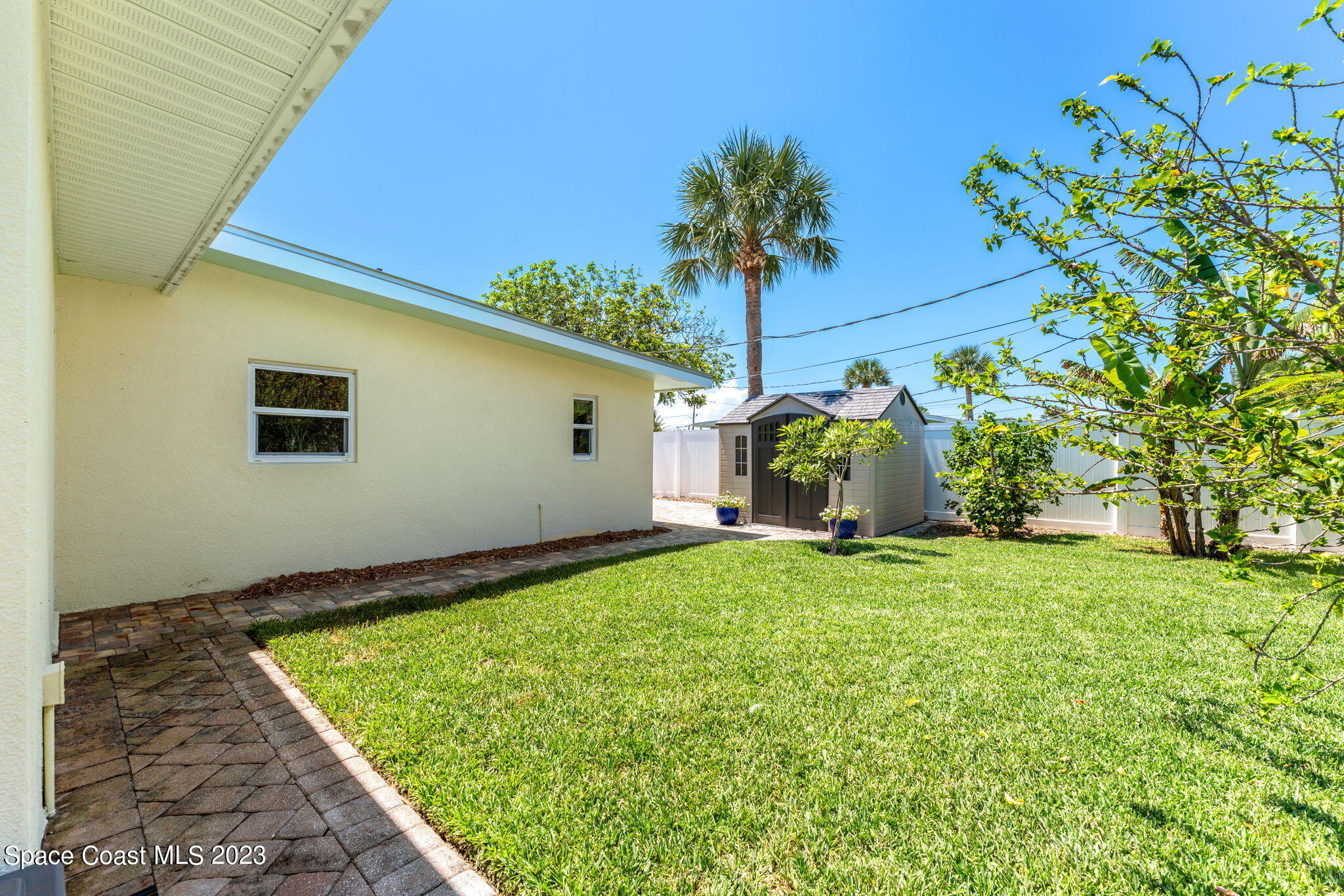 2230 Reef Avenue Indialantic, FL 32903 - Photo 25 of 31 a view of a backyard with plants and a garden
