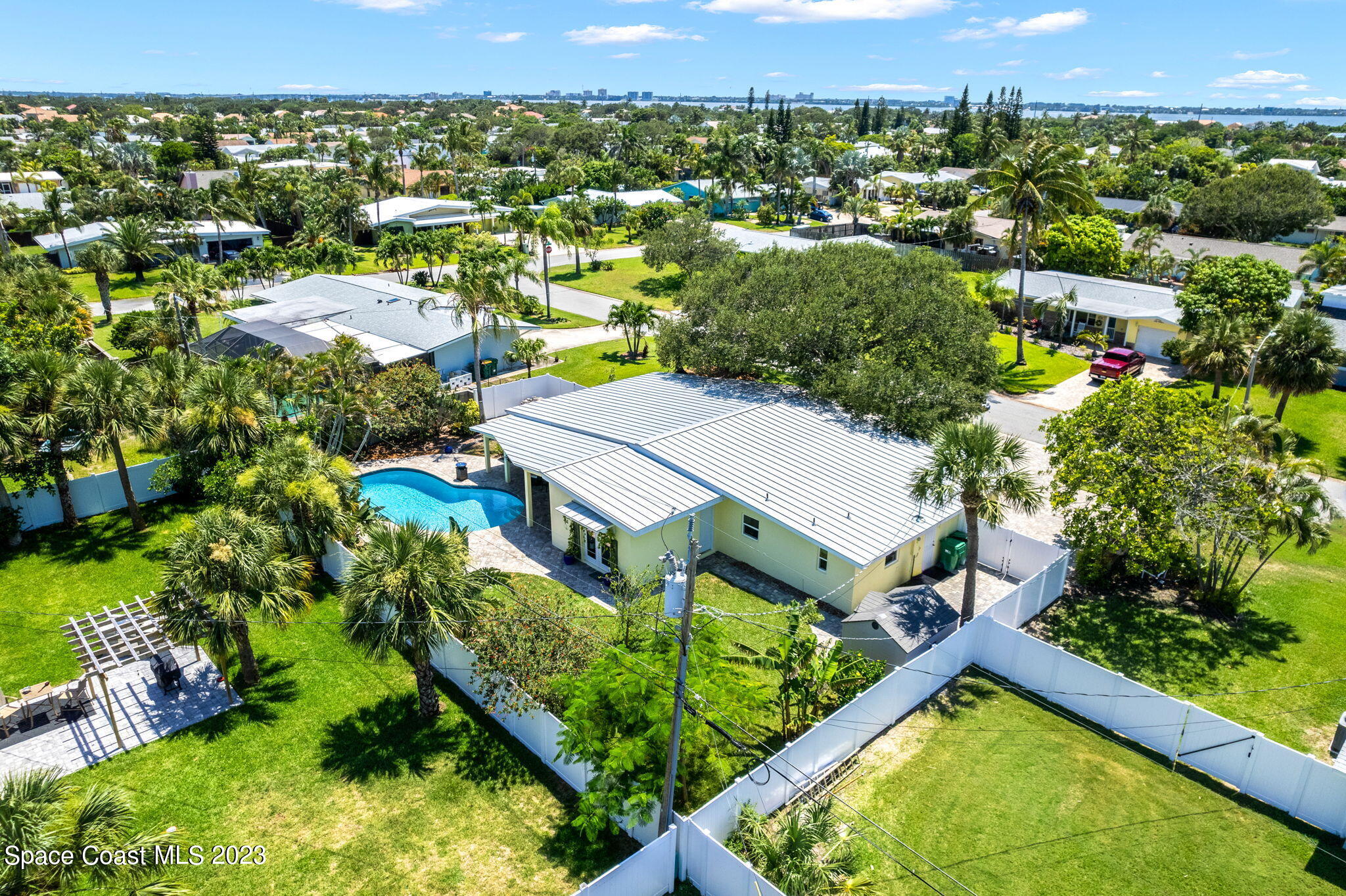 2230 Reef Avenue Indialantic, FL 32903 - Photo 27 of 31 an aerial view of residential house with outdoor space and swimming pool