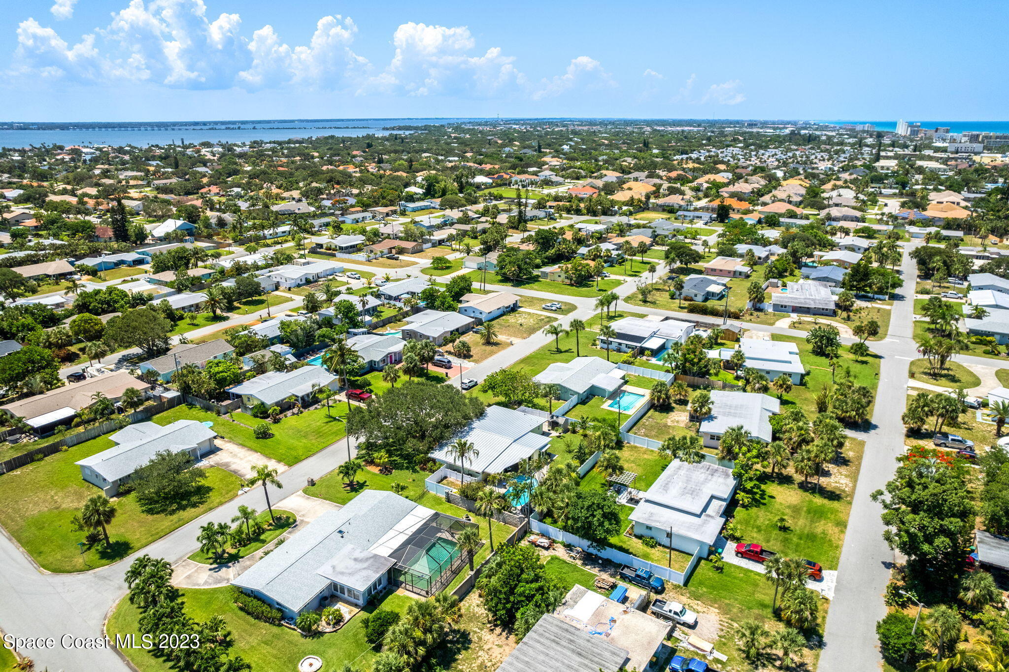 2230 Reef Avenue Indialantic, FL 32903 - Photo 28 of 31 an aerial view of residential houses with outdoor space and trees