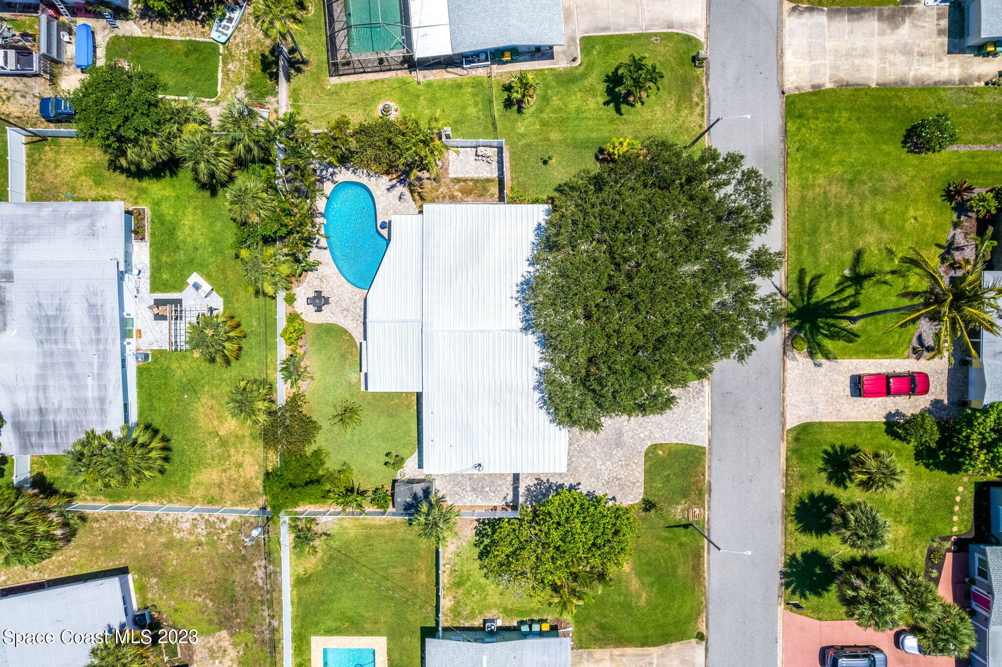 2230 Reef Avenue Indialantic, FL 32903 - Photo 30 of 31 an aerial view of a house with a yard and garden