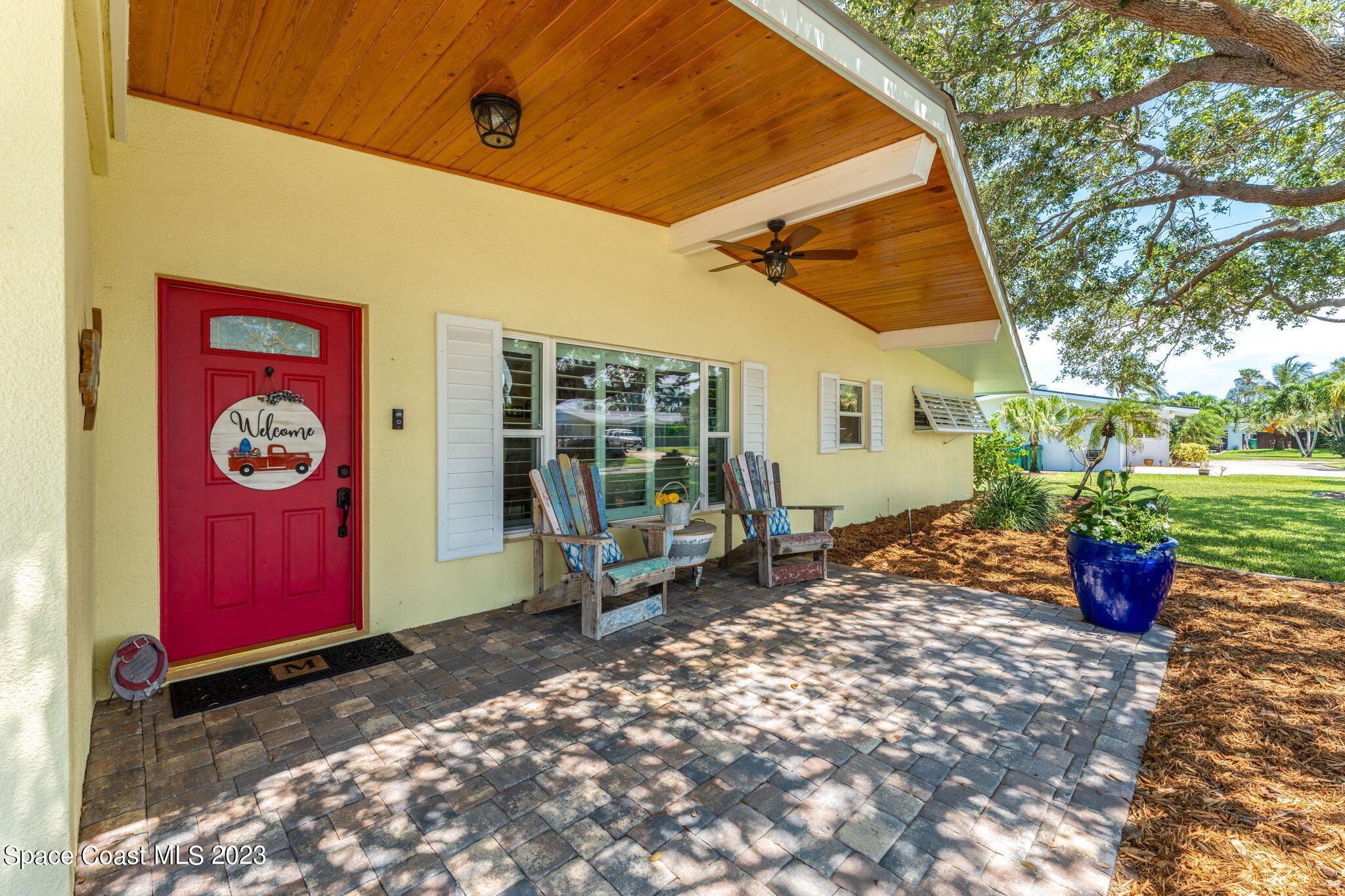 2230 Reef Avenue Indialantic, FL 32903 - Photo 3 of 31 a view of a red chairs in front of a building