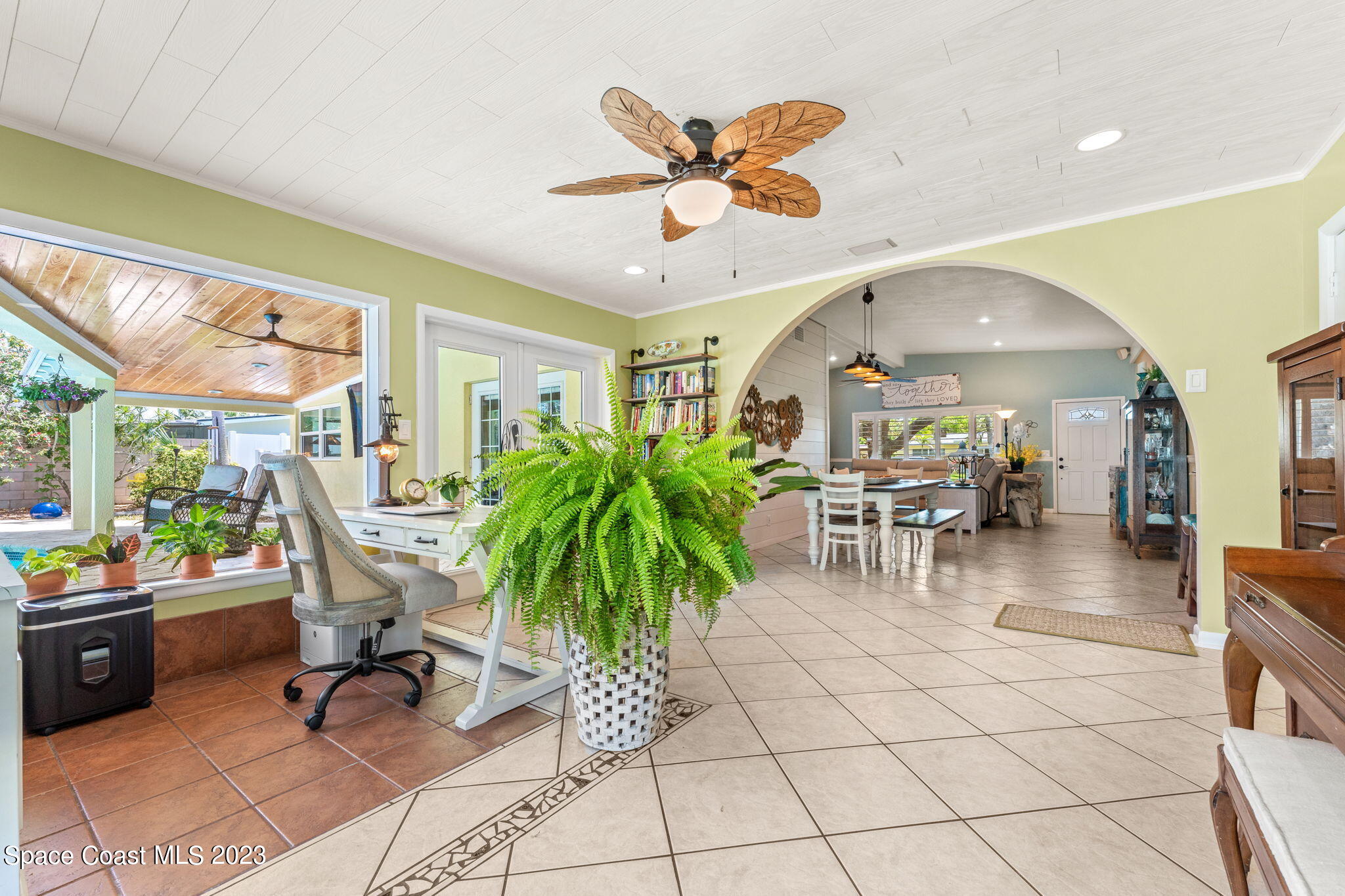 2230 Reef Avenue Indialantic, FL 32903 - Photo 9 of 31 a view of a livingroom with furniture and a potted plant