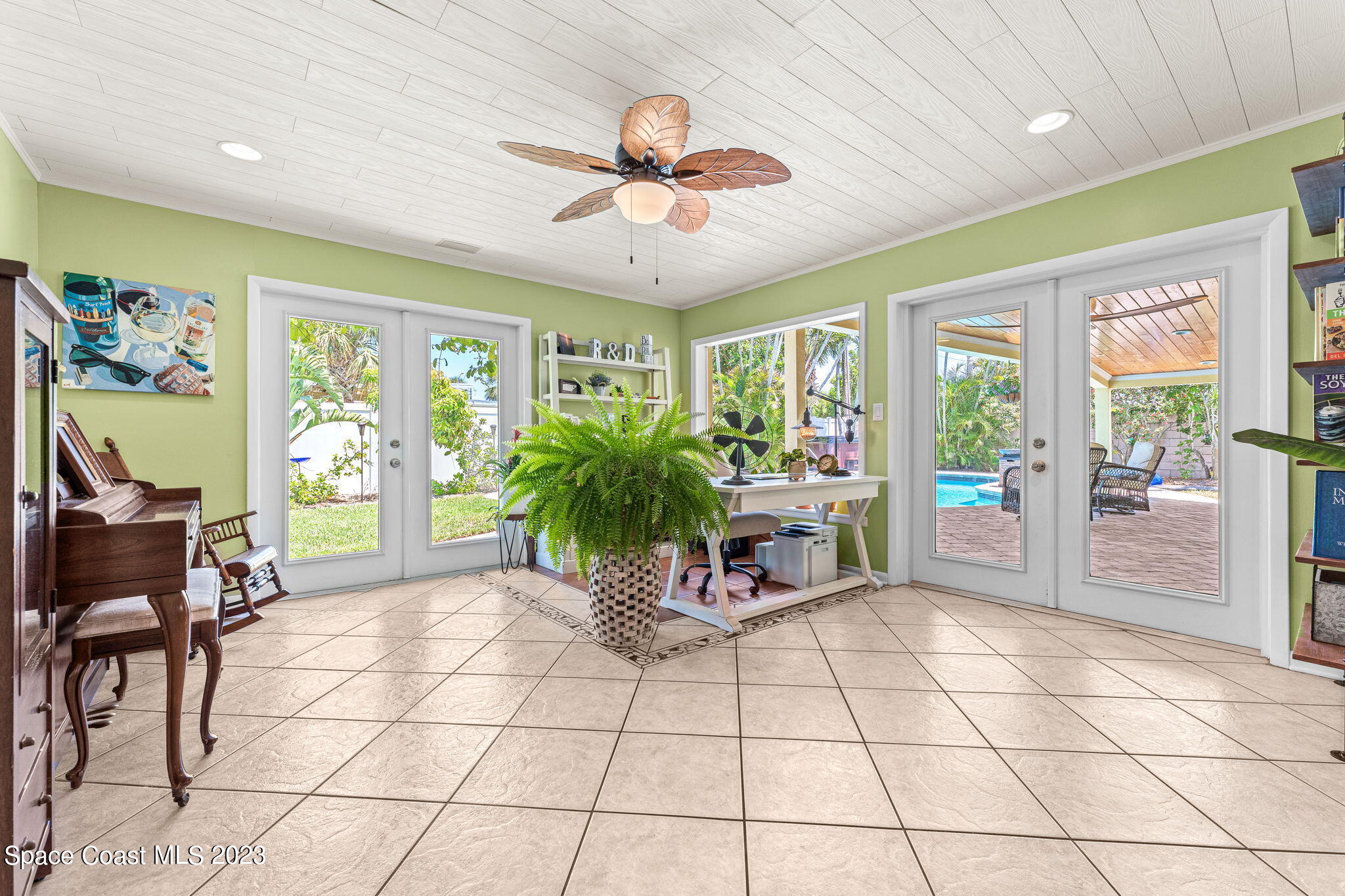 2230 Reef Avenue Indialantic, FL 32903 - Photo 10 of 31 a view of a livingroom with furniture and a potted plant