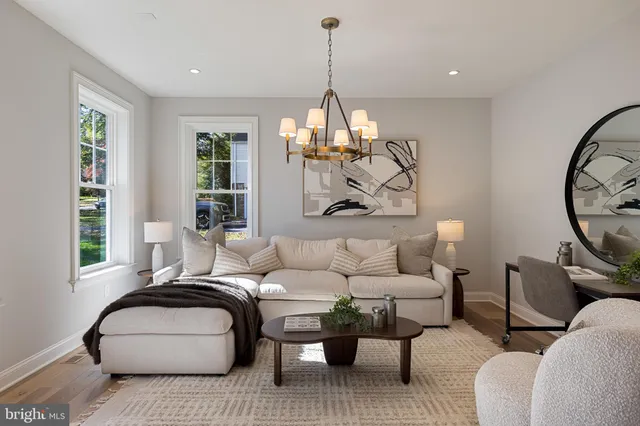 a view of a dining room with furniture wooden floor and chandelier