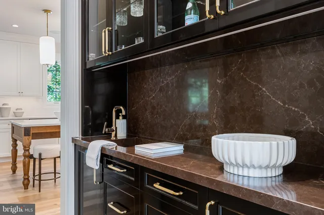 a spacious bathroom with a double vanity sink and a mirror