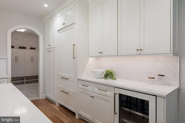 a bathroom with a mirror a bathtub and shower