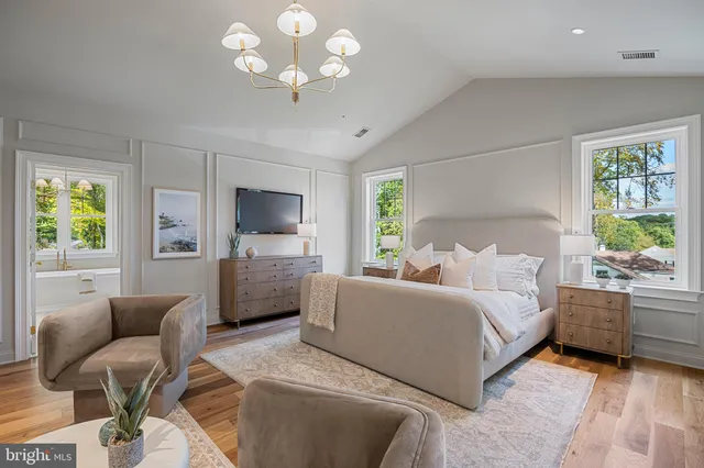 a backyard of a house with swimming pool and large trees