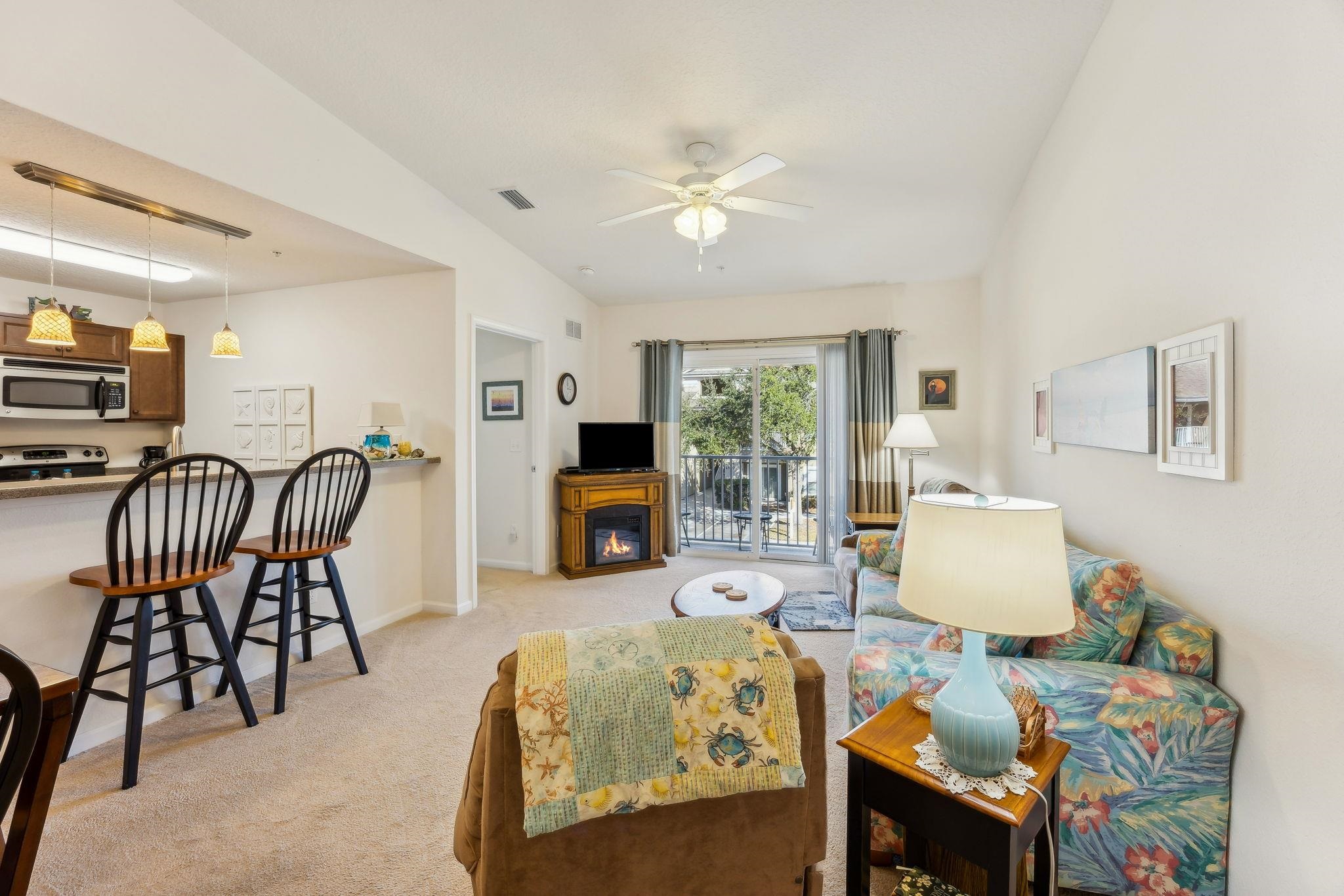 2861 Golden Lake Loop St. Augustine, FL 32084 - Photo 14 of 40 Living room with light carpet and ceiling fan