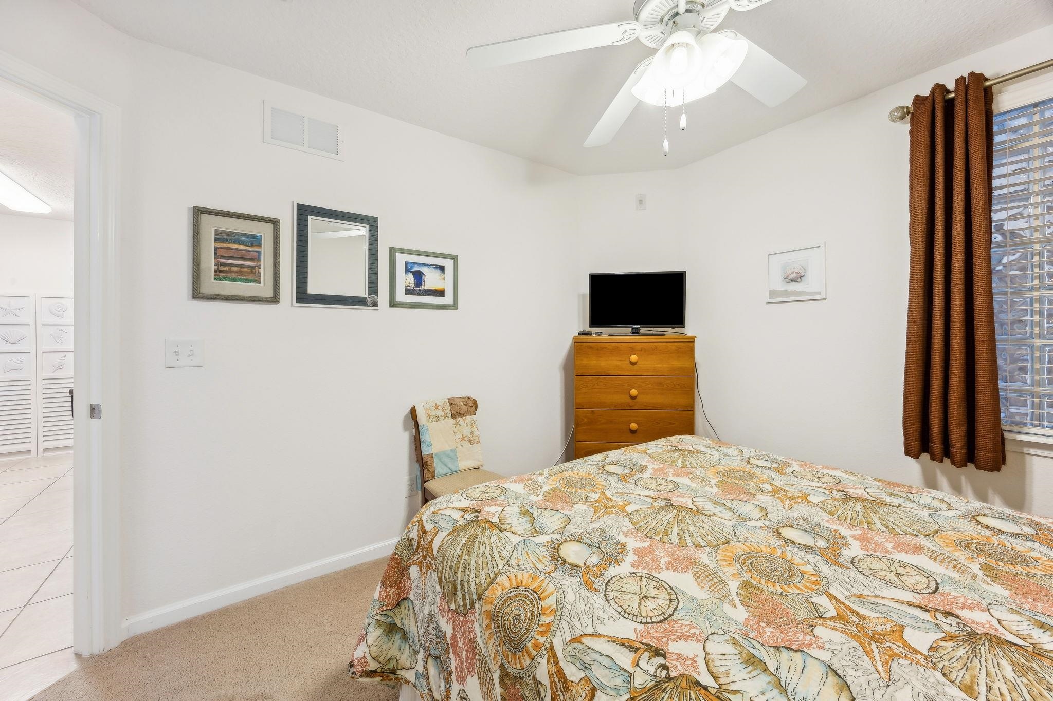 2861 Golden Lake Loop St. Augustine, FL 32084 - Photo 21 of 40 Bedroom with ceiling fan and light colored carpet