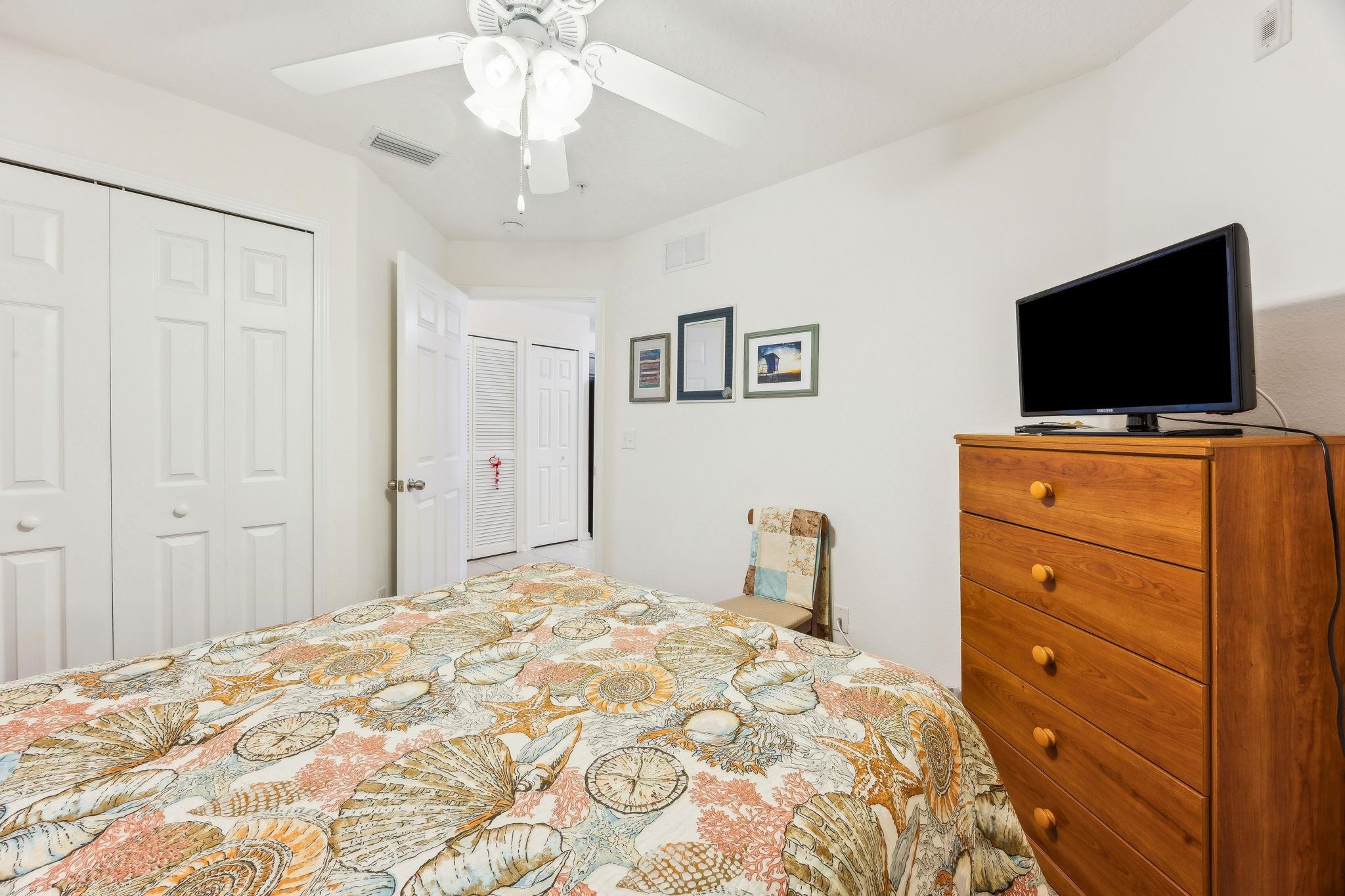 2861 Golden Lake Loop St. Augustine, FL 32084 - Photo 22 of 40 Bedroom with a closet and a ceiling fan