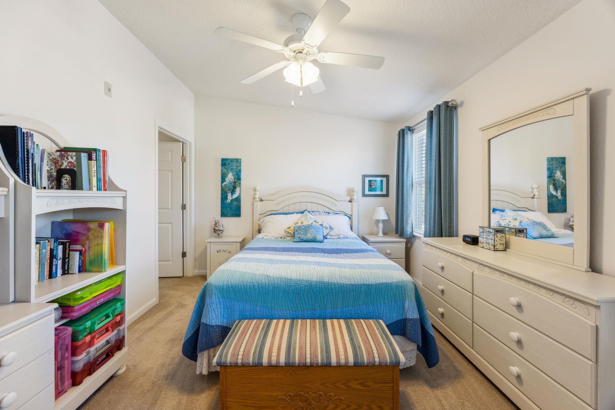 2861 Golden Lake Loop St. Augustine, FL 32084 - Photo 25 of 40 Bedroom featuring light colored carpet and ceiling fan