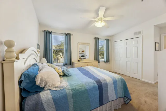 a bed room with a bed and a chandelier