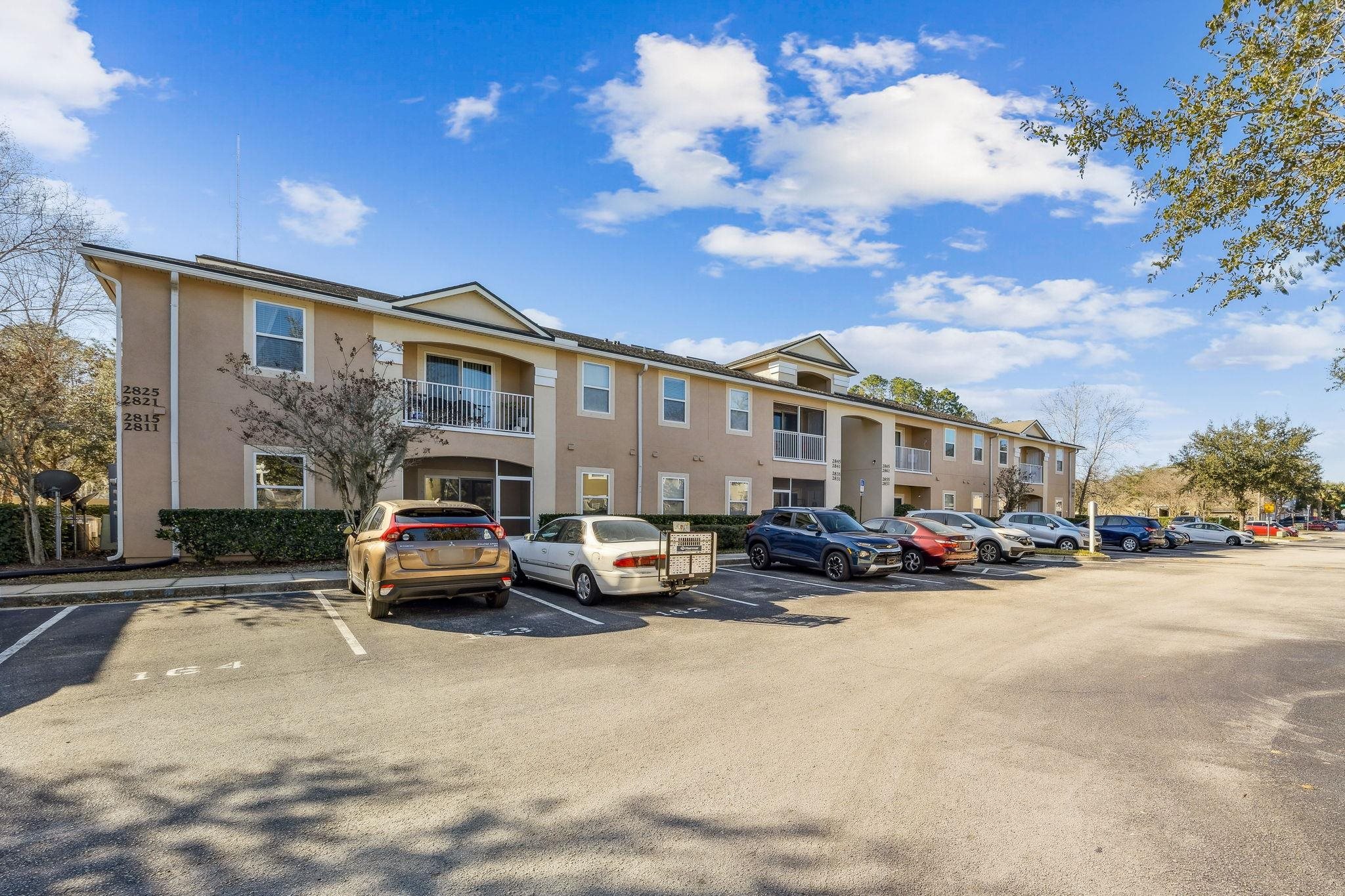 2861 Golden Lake Loop St. Augustine, FL 32084 - Photo 3 of 40 View of building exterior featuring uncovered parking