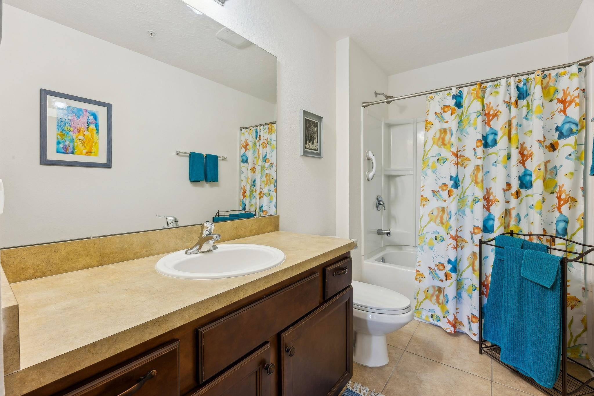 2861 Golden Lake Loop St. Augustine, FL 32084 - Photo 31 of 40 Bathroom with shower / bath combination with curtain, vanity, and light tile patterned floors