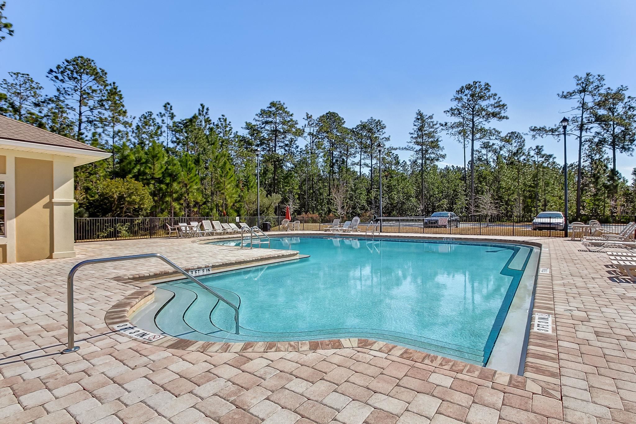 2861 Golden Lake Loop St. Augustine, FL 32084 - Photo 35 of 40 Community pool featuring a patio area and view of wooded area