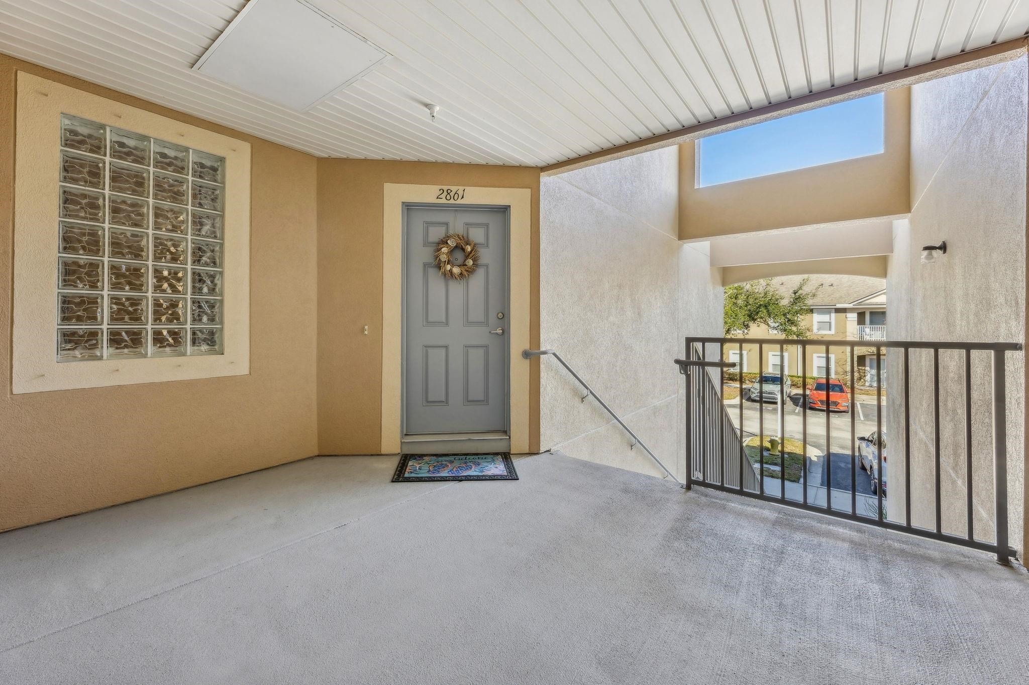 2861 Golden Lake Loop St. Augustine, FL 32084 - Photo 6 of 40 Entrance to property featuring stucco siding