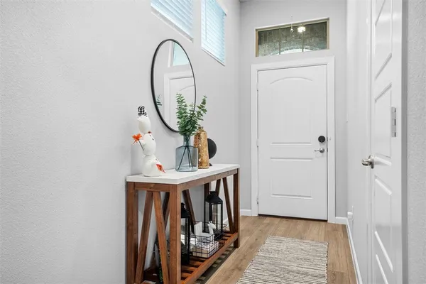 a view of entryway with wooden floor
