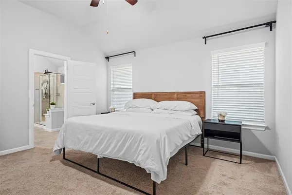 a bedroom with a bed and a table in it