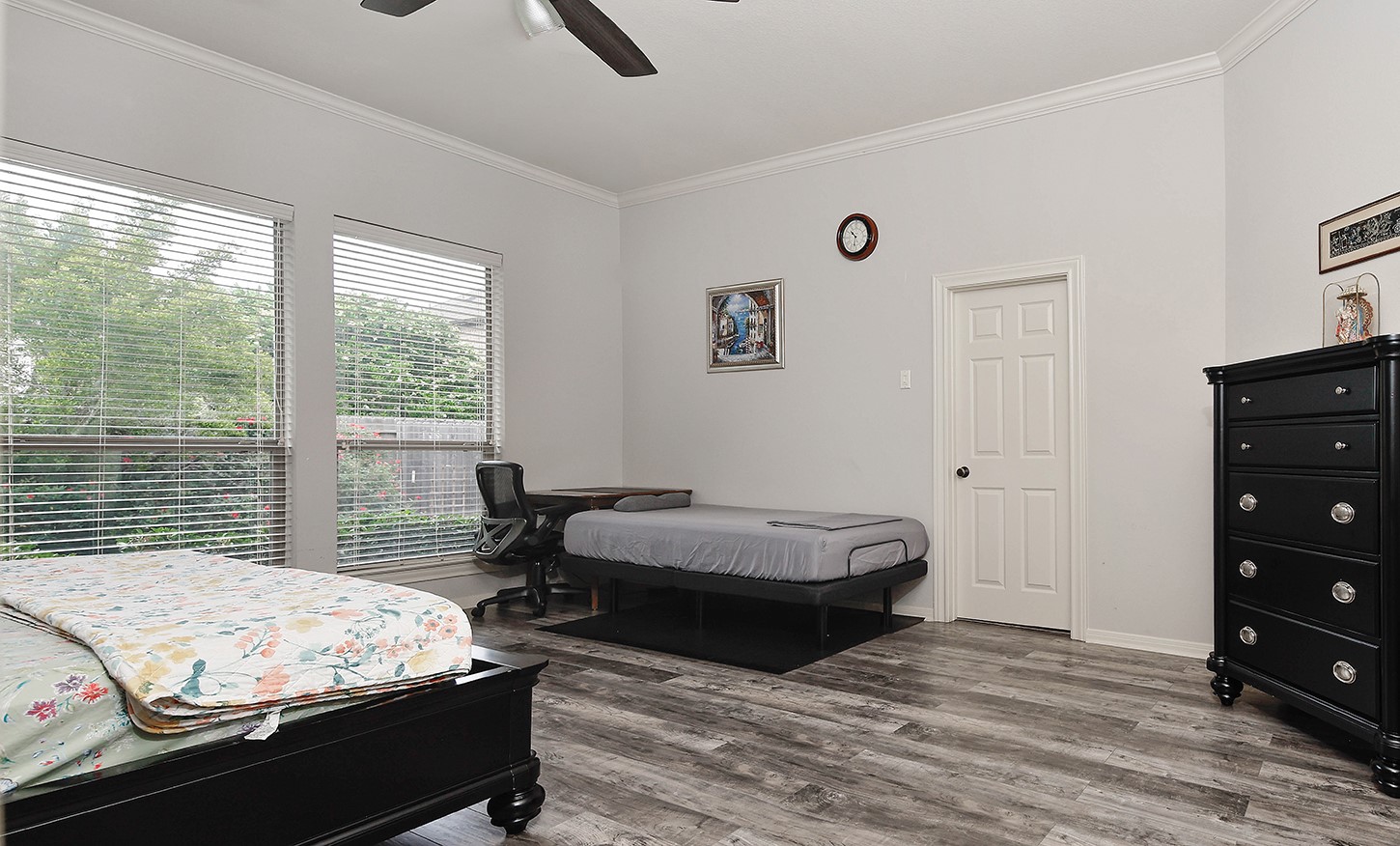 18722 Duke Lake Drive Spring, TX 77388 - Photo 14 of 26 a bedroom with a bed and wooden floor
