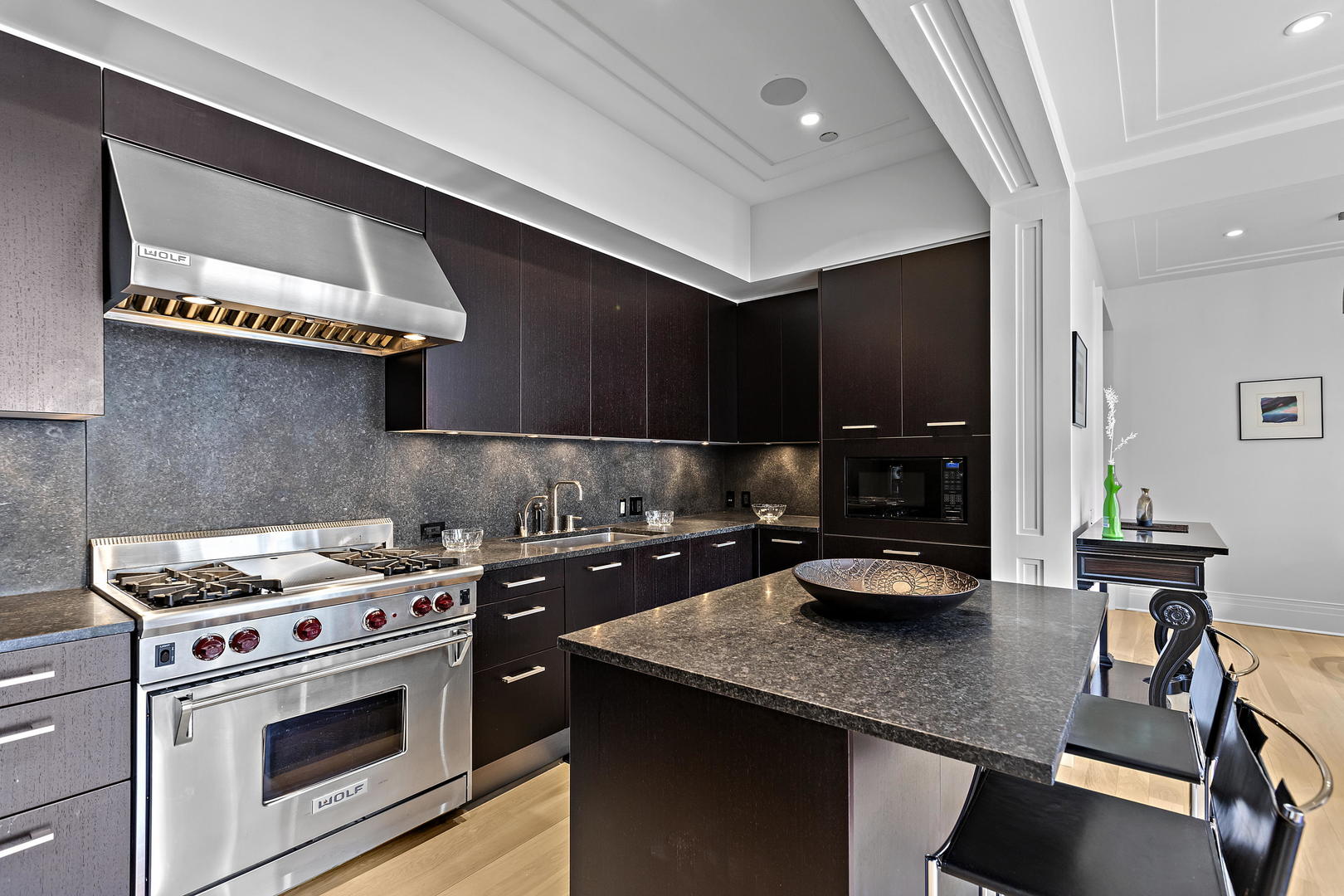 159 East Walton Place, Unit 9B Chicago, IL 60611 - Photo 14 of 28 a kitchen with a sink a stove and cabinets
