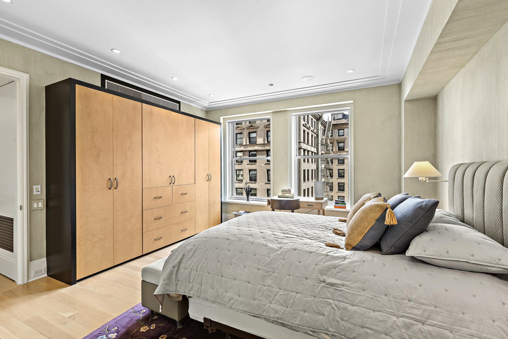 159 East Walton Place, Unit 9B Chicago, IL 60611 - Photo 18 of 28 a bedroom with a large bed and a large window