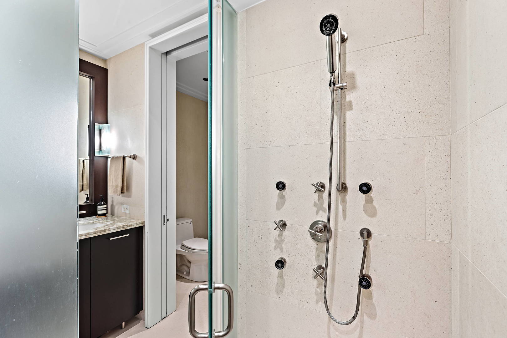 159 East Walton Place, Unit 9B Chicago, IL 60611 - Photo 20 of 28 a bathroom with a shower