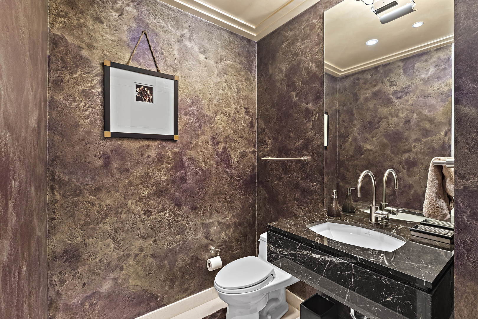 159 East Walton Place, Unit 9B Chicago, IL 60611 - Photo 22 of 28 a bathroom with a granite countertop toilet a sink and a mirror