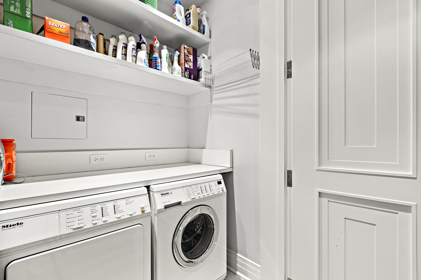 159 East Walton Place, Unit 9B Chicago, IL 60611 - Photo 23 of 28 a close up view of a utility room with washer and dryer