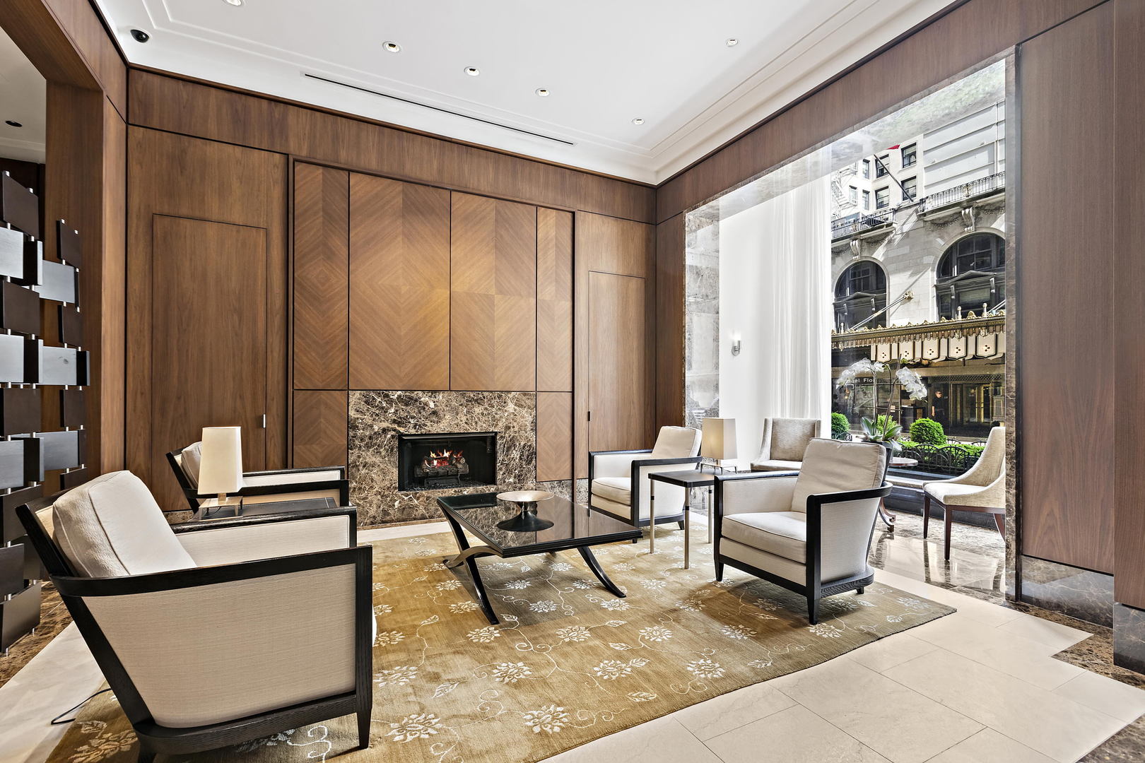 159 East Walton Place, Unit 9B Chicago, IL 60611 - Photo 4 of 28 a living room with furniture a fireplace and large windows