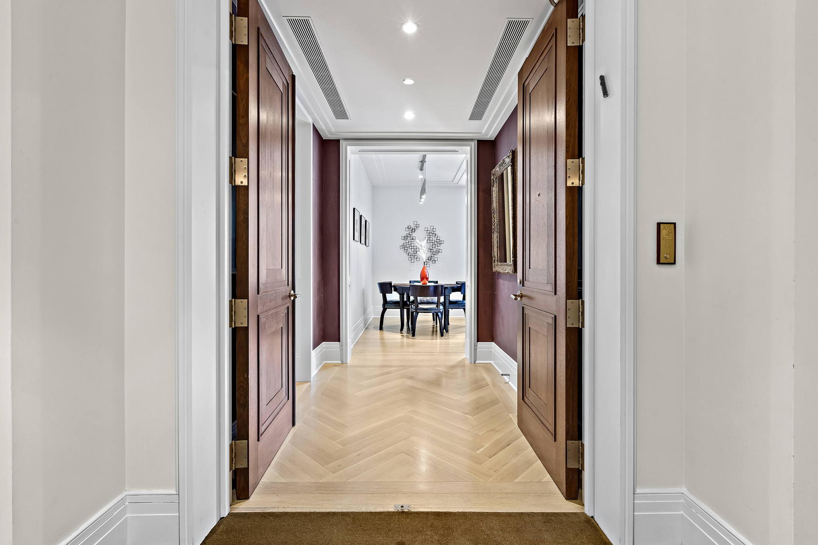 159 East Walton Place, Unit 9B Chicago, IL 60611 - Photo 5 of 28 a view of a hallway with wooden floor and a living room