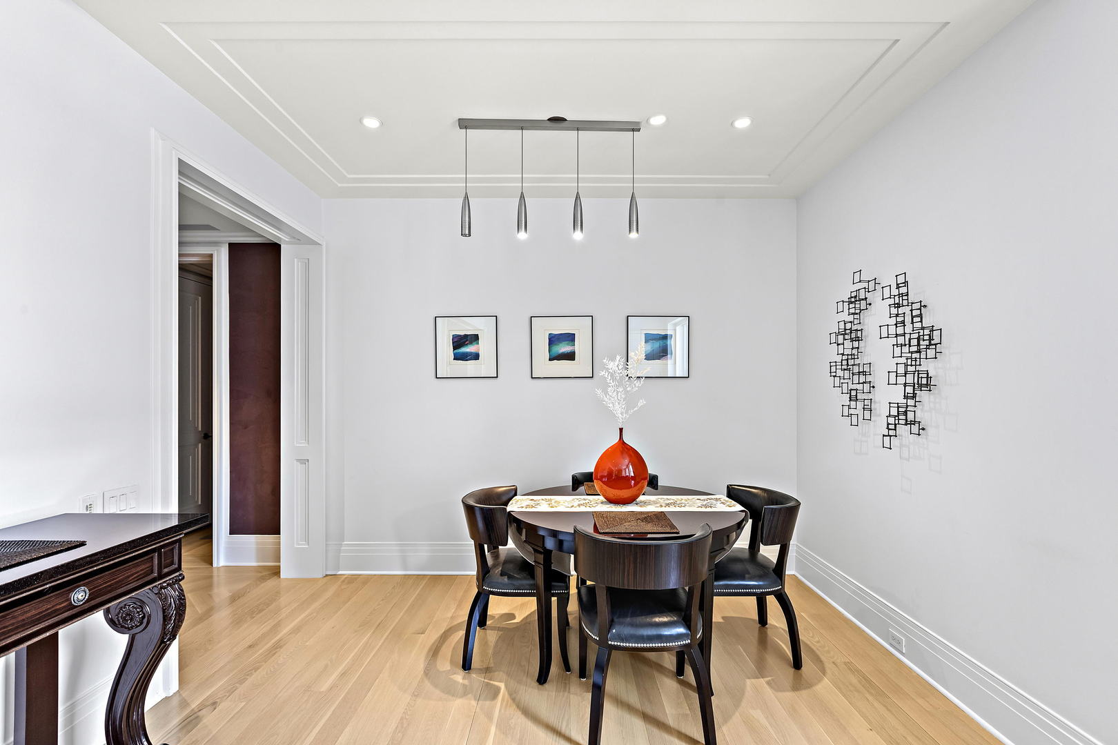 159 East Walton Place, Unit 9B Chicago, IL 60611 - Photo 6 of 28 a view of a dining room with furniture and wooden floor