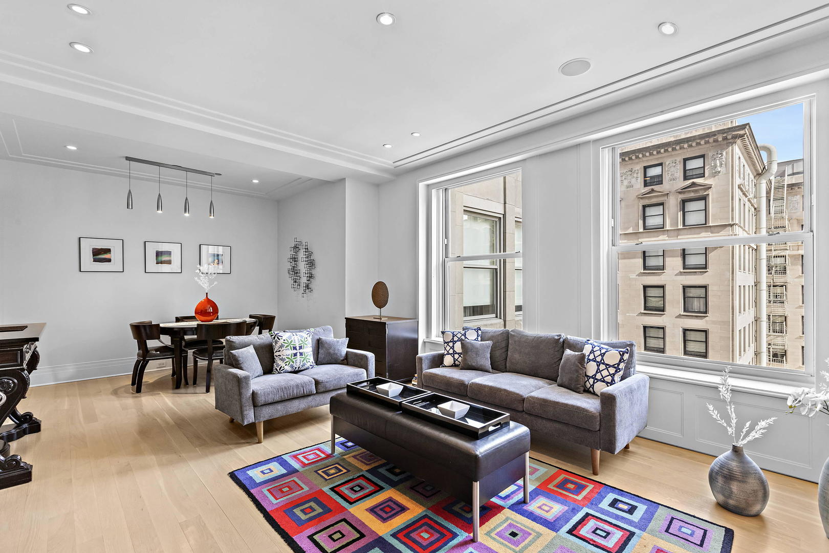 159 East Walton Place, Unit 9B Chicago, IL 60611 - Photo 7 of 28 a living room with furniture a rug and a window