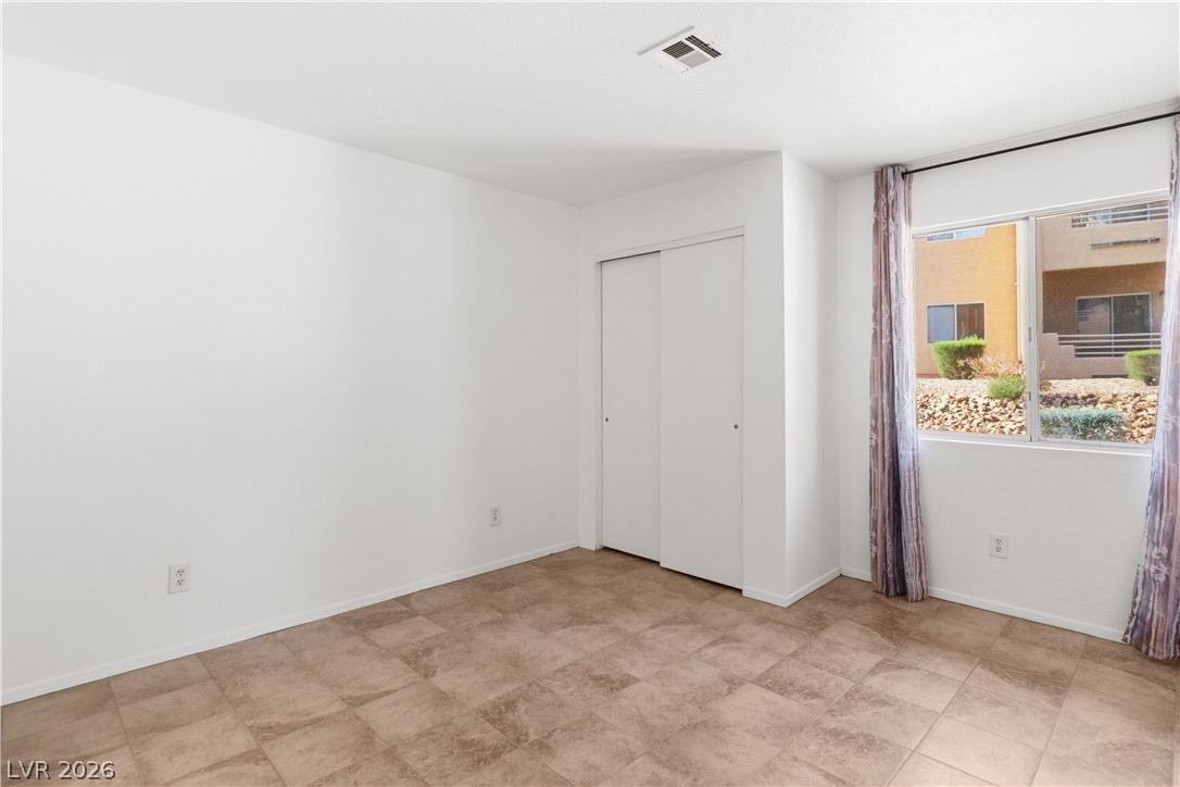 2232 Aspen Mirror Way, Unit 103 Laughlin, NV 89029 - Photo 17 of 50 Unfurnished bedroom with a closet and baseboards