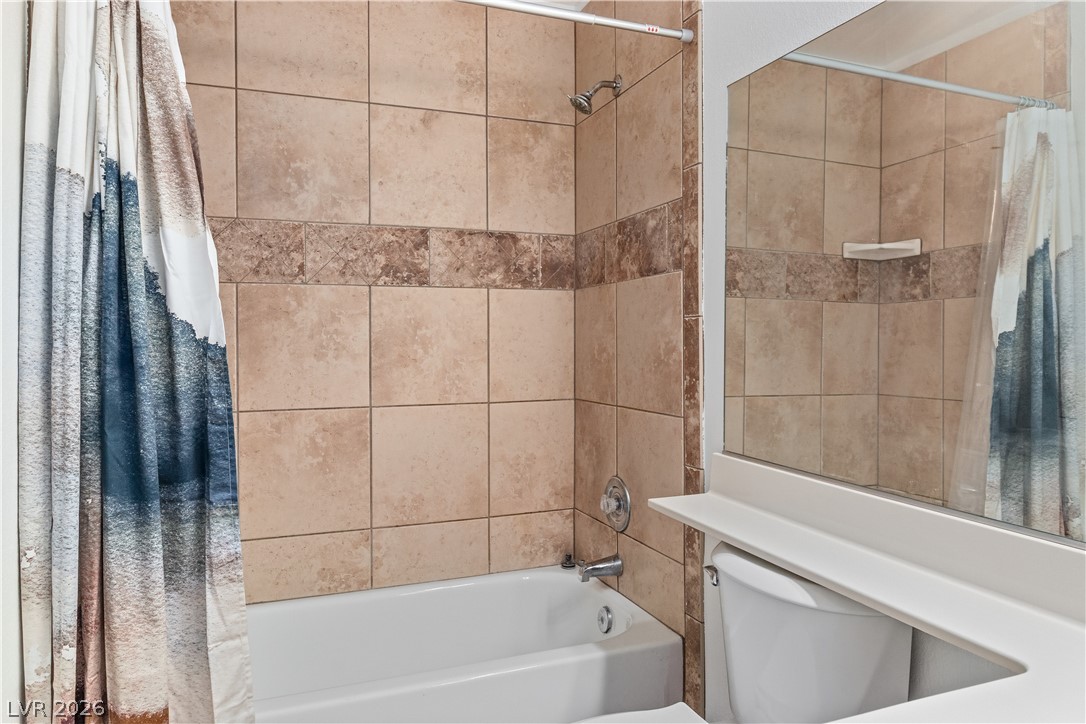 2232 Aspen Mirror Way, Unit 103 Laughlin, NV 89029 - Photo 20 of 50 Bathroom featuring shower / bath combo and toilet