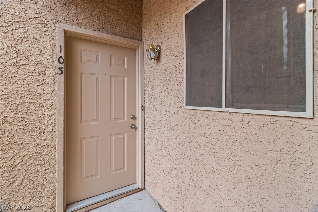 2232 Aspen Mirror Way, Unit 103 Laughlin, NV 89029 - Photo 2 of 50 Property entrance with stucco siding
