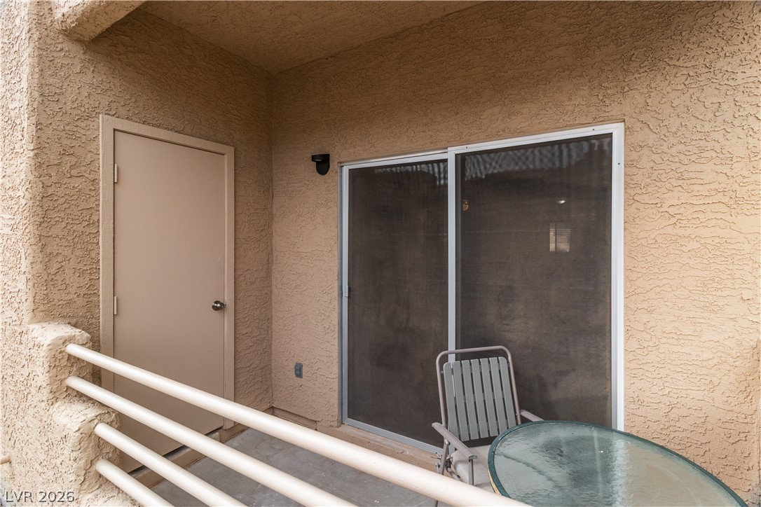 2232 Aspen Mirror Way, Unit 103 Laughlin, NV 89029 - Photo 31 of 50 Doorway to property featuring stucco siding