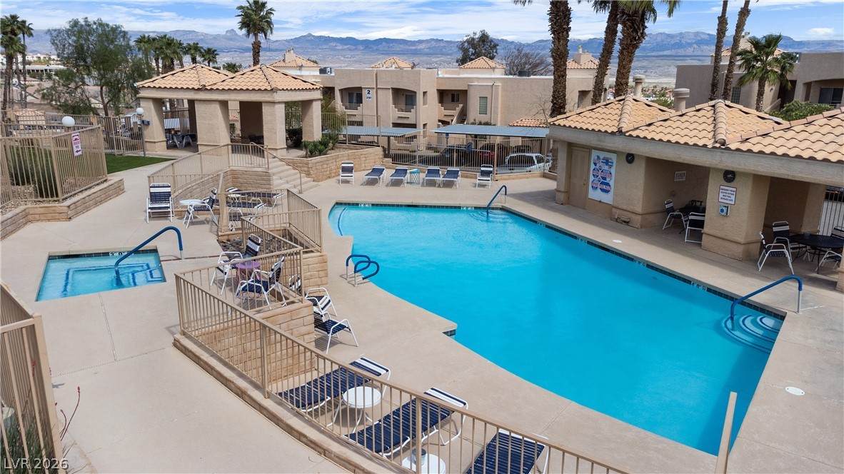 2232 Aspen Mirror Way, Unit 103 Laughlin, NV 89029 - Photo 48 of 50 Community pool featuring a mountain view and a patio area