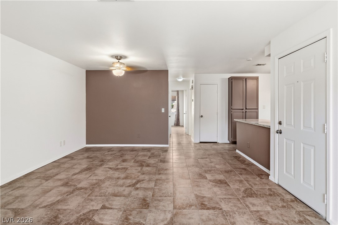 2232 Aspen Mirror Way, Unit 103 Laughlin, NV 89029 - Photo 6 of 50 Empty room with ceiling fan and baseboards