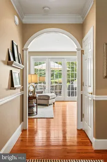 a kitchen with granite countertop a refrigerator and a sink